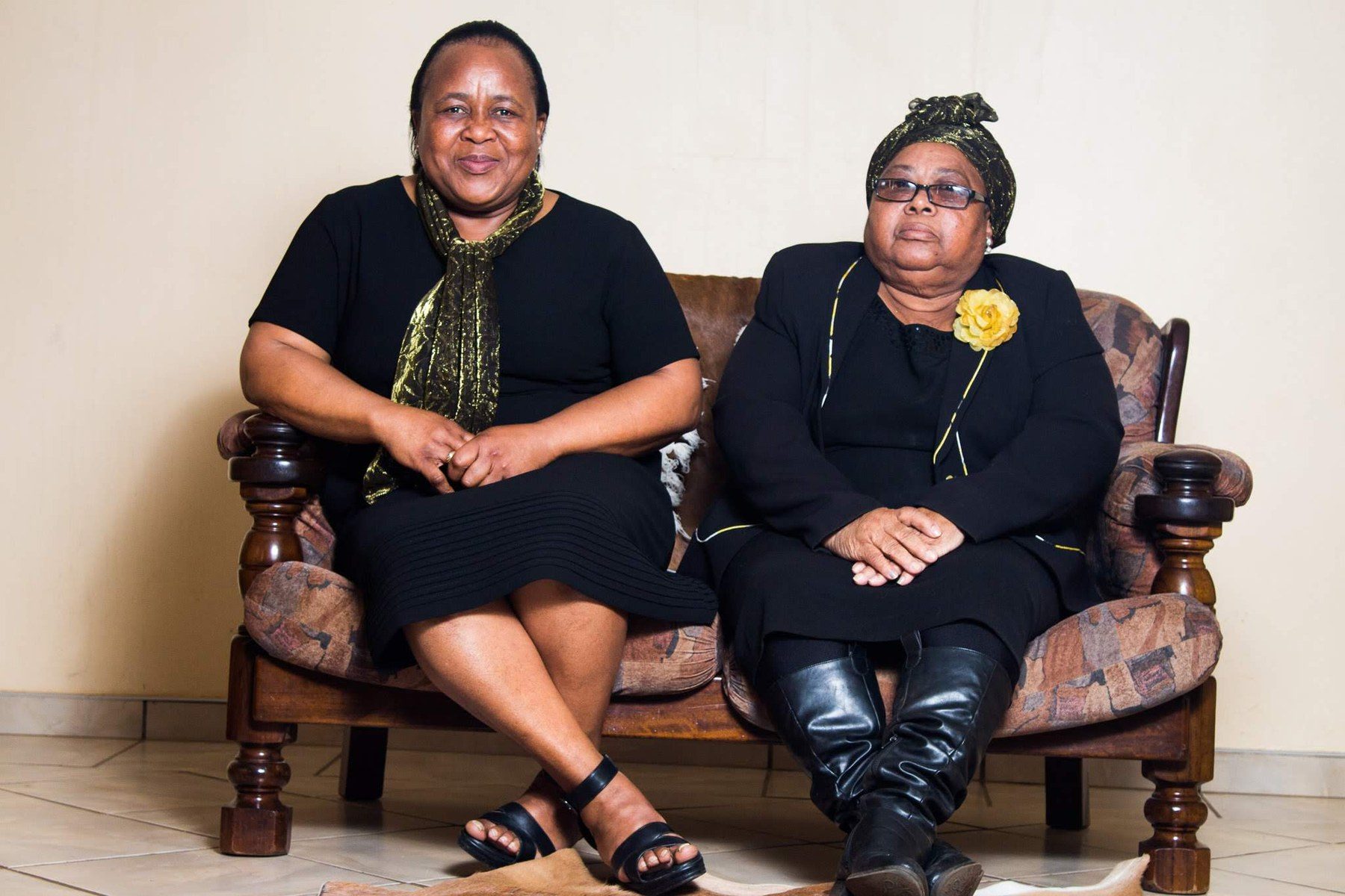 Lindiwe Millicent Mokuena seated beside a loved one.